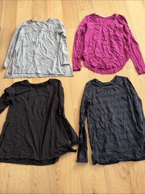 Assorted lululemon athletica Long-Sleeve Scoop Top in Pink, Gray, Black, and nav